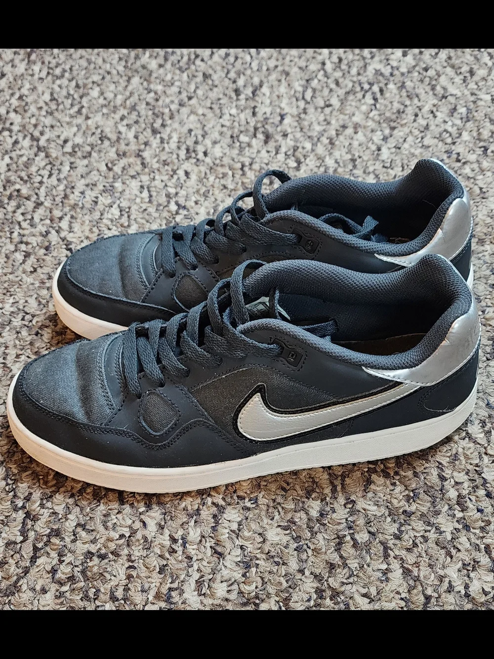 Nike Black Sneakers with Metallic Silver Swoosh and White Sole